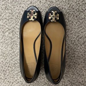 Tory Burch soft black leather peep toe wedges.